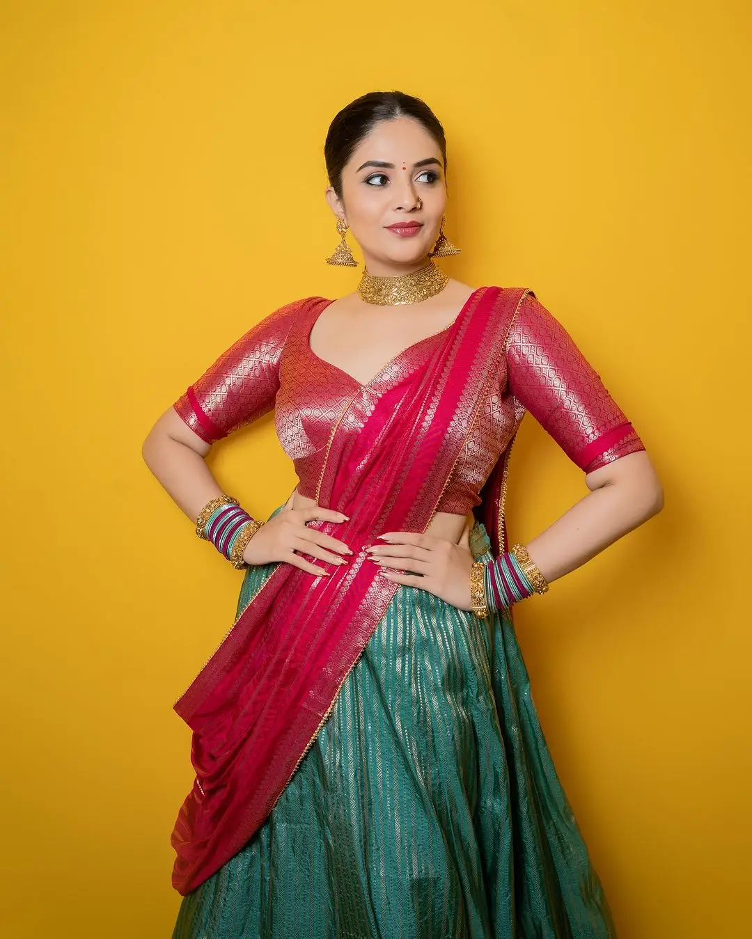 Telugu Actress Sreemukhi Stills In Green Lehenga Choli